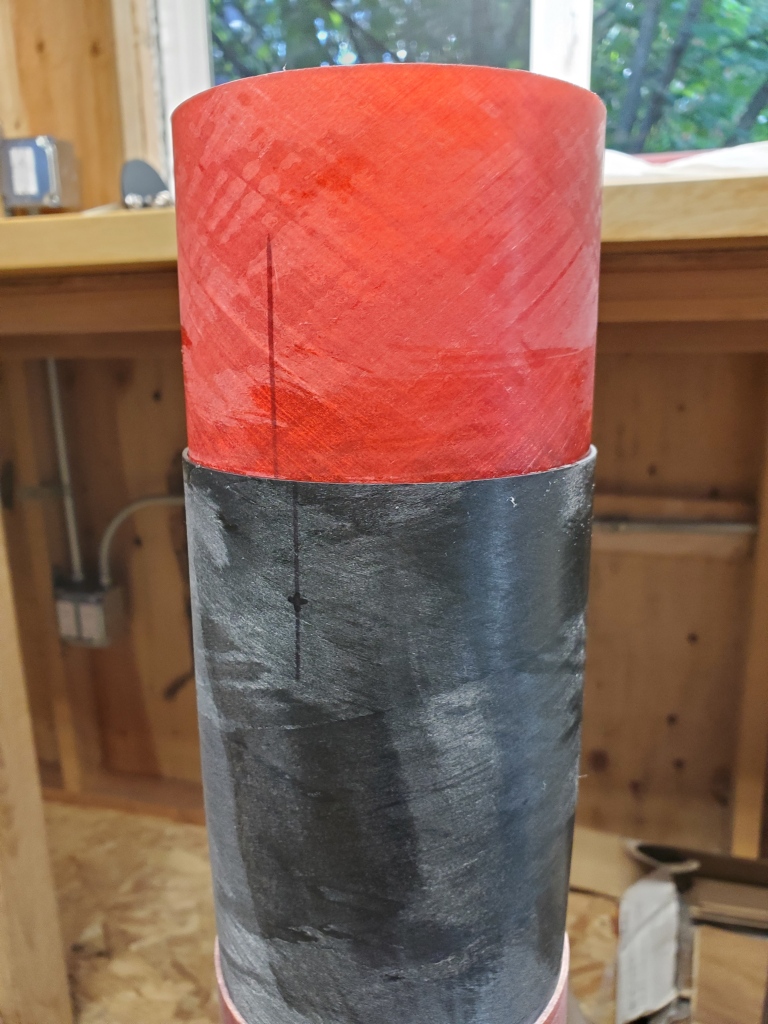 red fiberglass coupler secured inside grey nosecone